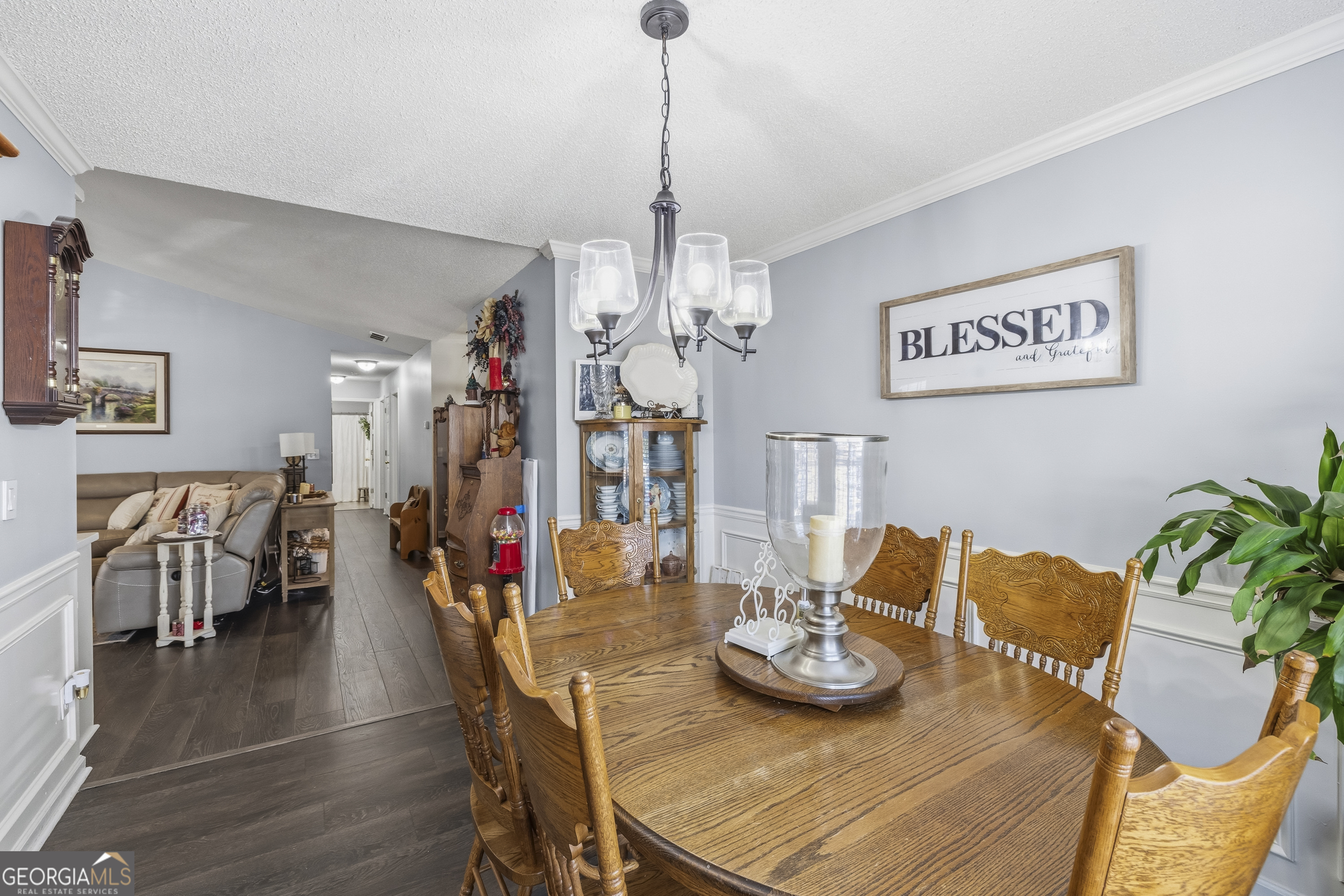460 Flyway Lane Winder, GA 30680 - Photo 14 of 32 a view of a dining room with furniture wooden floor and chandelier
