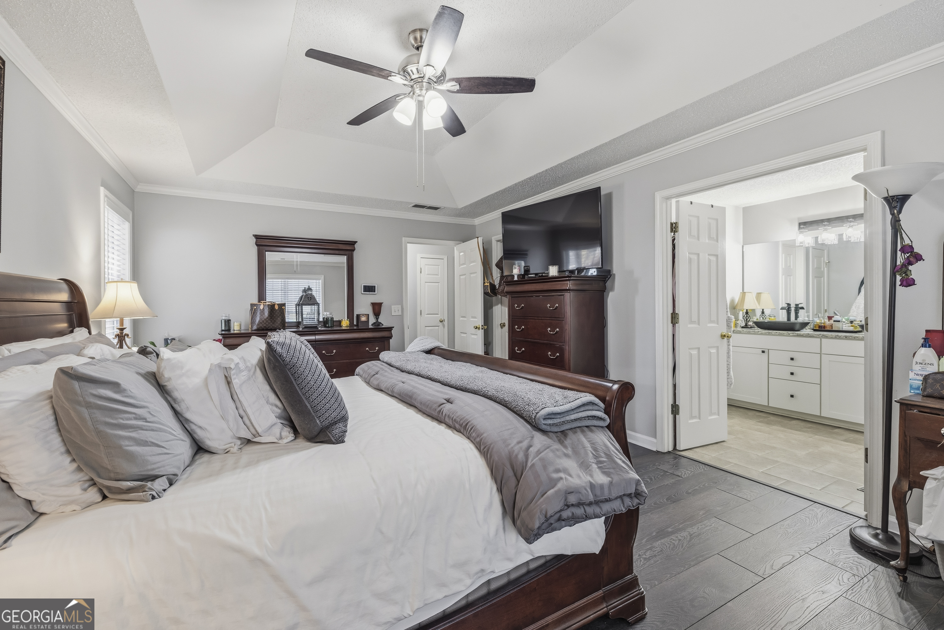 460 Flyway Lane Winder, GA 30680 - Photo 18 of 32 a bedroom with a bed and a chandelier