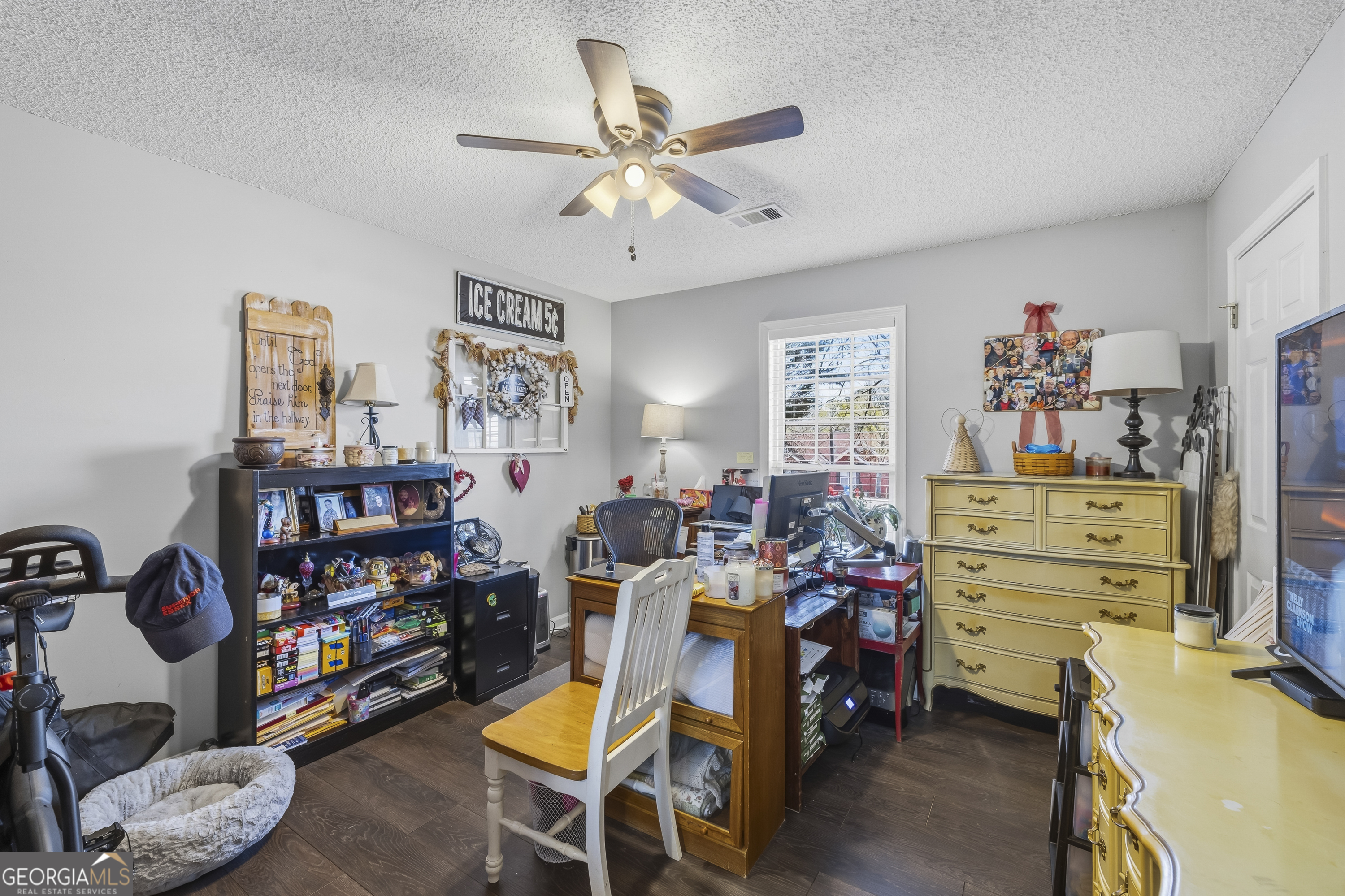 460 Flyway Lane Winder, GA 30680 - Photo 24 of 32 a bed room with a bed and a bookshelf