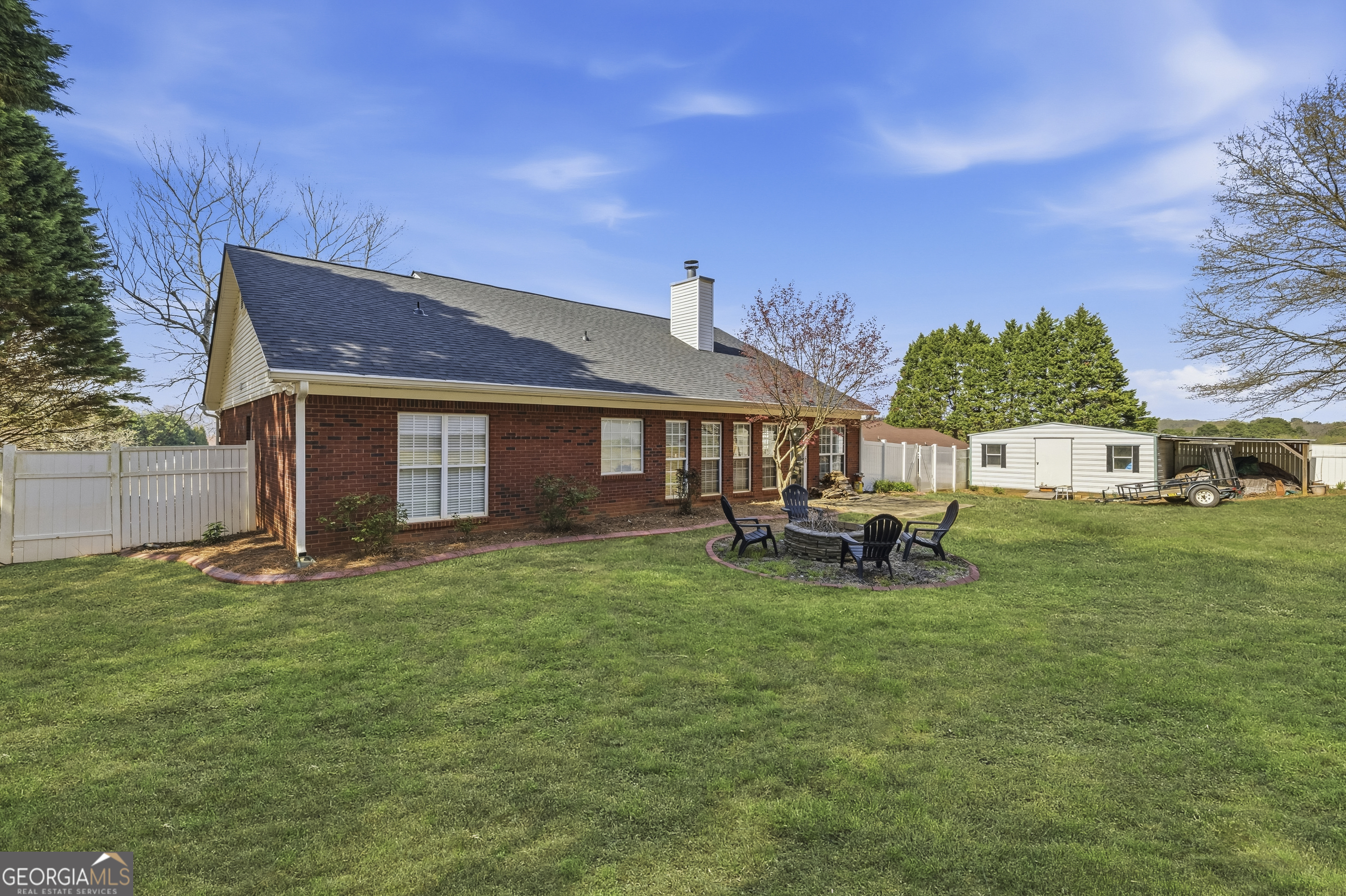 460 Flyway Lane Winder, GA 30680 - Photo 26 of 32 a front view of a house with a garden and porch