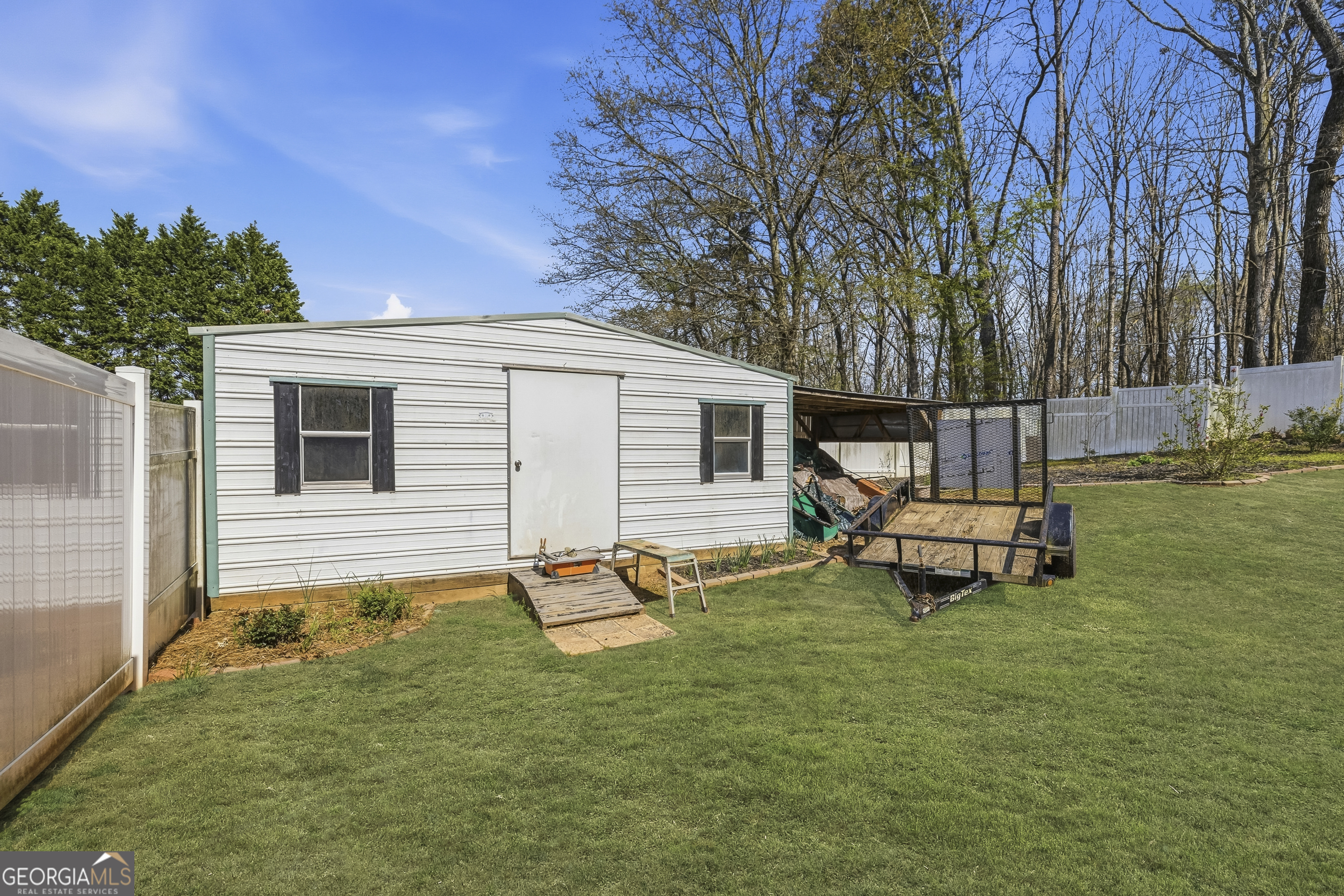 460 Flyway Lane Winder, GA 30680 - Photo 28 of 32 a backyard of a house with table and chairs
