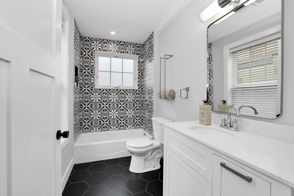 34 Temple Street Boston, MA 02126 - Photo 20 of 38 a bathroom with a sink a toilet and shower