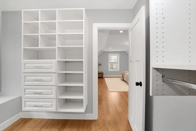 a view of bathroom with shower and wooden floor