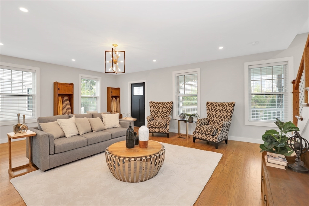 34 Temple Street Boston, MA 02126 - Photo 4 of 38 a living room with furniture and a large window