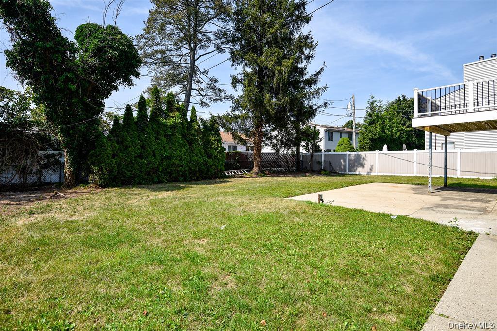 65 Bluebird Lane Plainview, NY 11803 - Photo 26 of 28 a view of a house with a yard