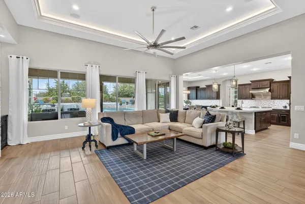a kitchen with granite countertop a stove and a wooden floor