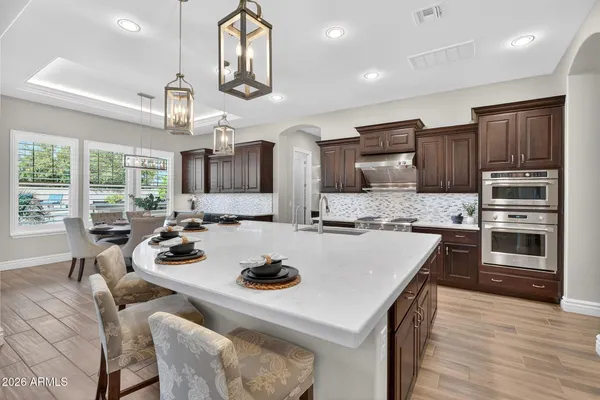 a living room with furniture ceiling fan and a window