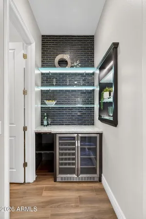 a spacious bathroom with a double vanity sink large mirror and a bathtub