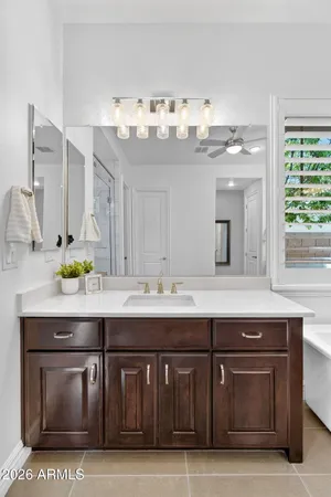 a kitchen with white cabinets and a stove