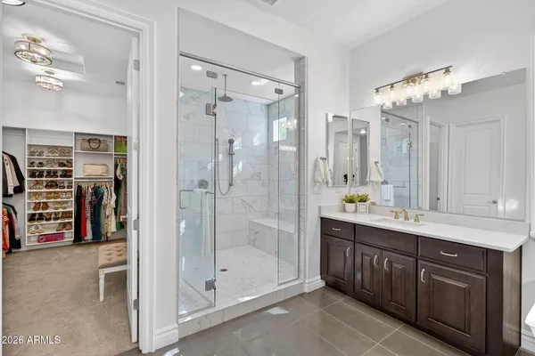 a view of a house with backyard swimming pool and sitting area