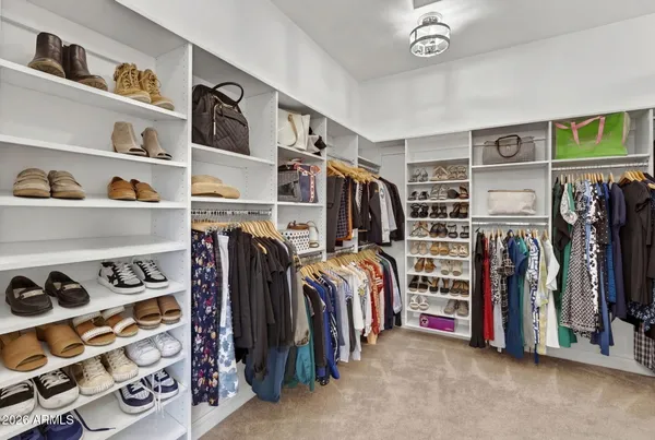 a view of a house with pool and chairs