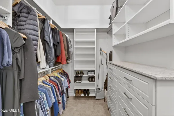 a front view of a house with a yard and patio