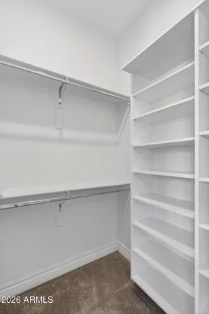 a view of a house with swimming pool and a yard