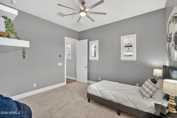 a view of a house with a yard and table in the patio