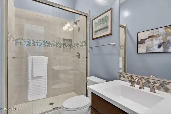 a view of a house with a swimming pool and a yard