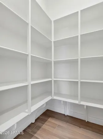 a front view of a house with a garden and yard