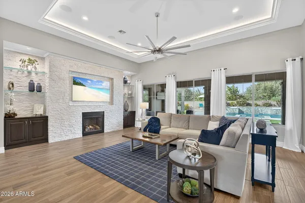 a living room with furniture and a fireplace
