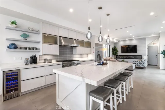 a kitchen with a table chairs stove and microwave