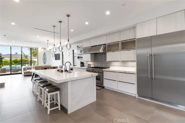 a kitchen with kitchen island a sink and appliances
