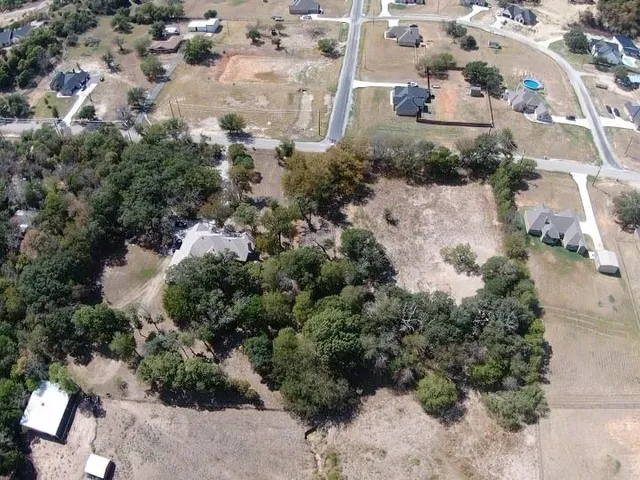 an aerial view of residential house with outdoor space