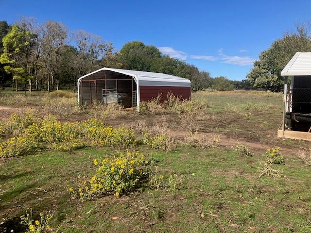 351 Sandlin Lane Springtown, TX 76082 - Photo 8 of 9 a view of a house with a yard