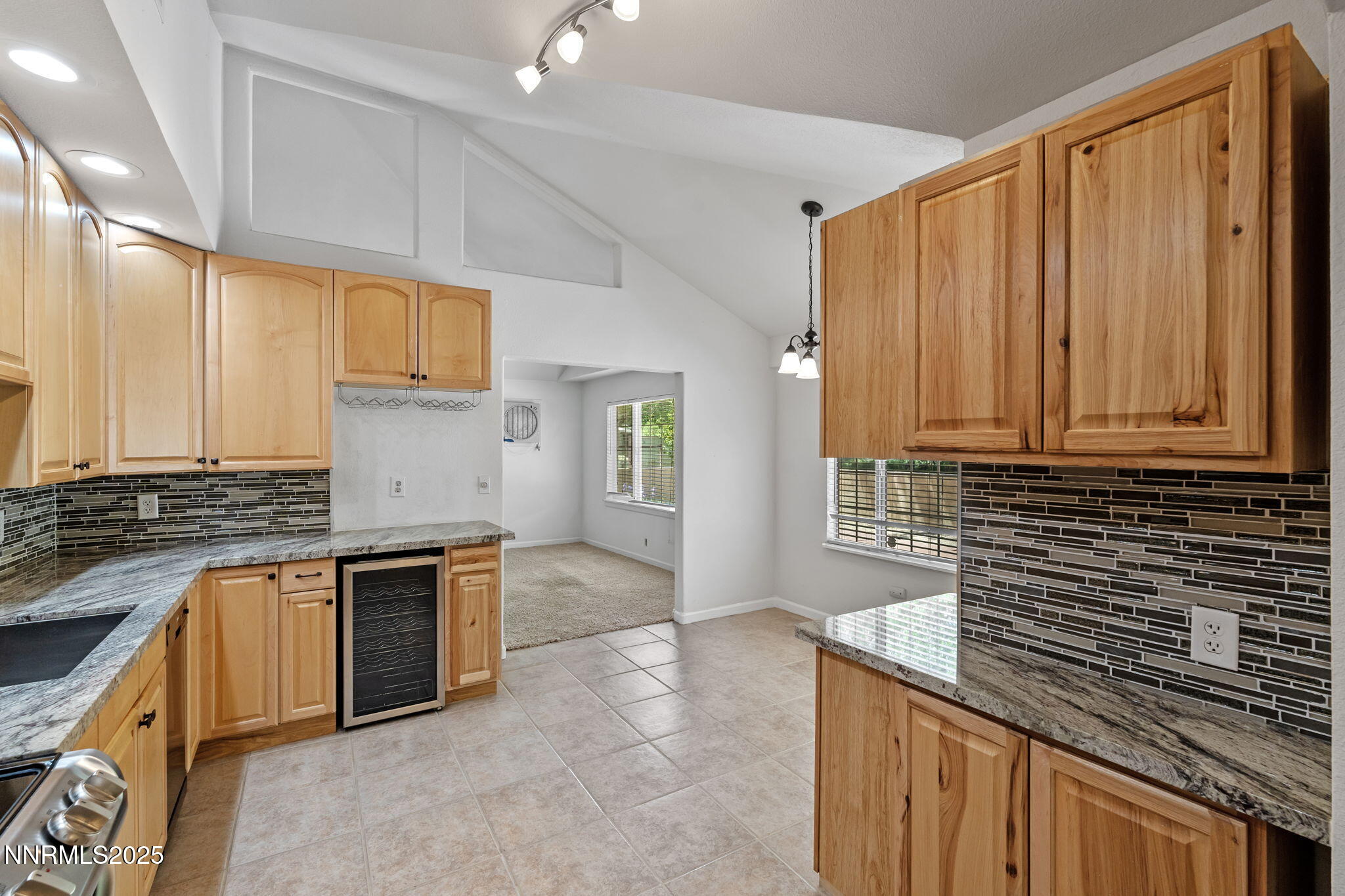 17860 South Virginia Street Reno, NV 89521 - Photo 11 of 46 a kitchen with stainless steel appliances granite countertop a sink and a stove