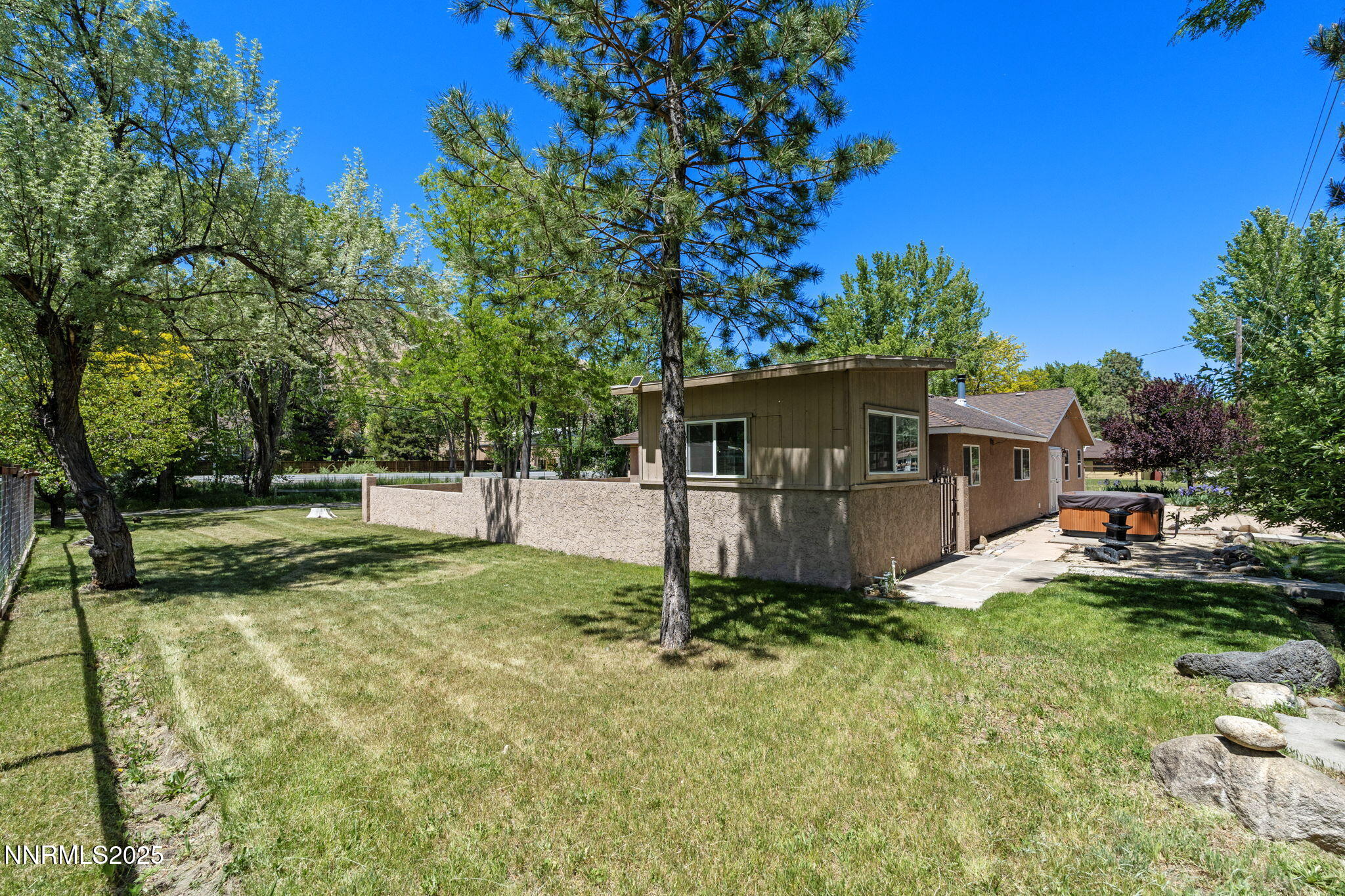 17860 South Virginia Street Reno, NV 89521 - Photo 37 of 46 a view of a house with backyard and a tree