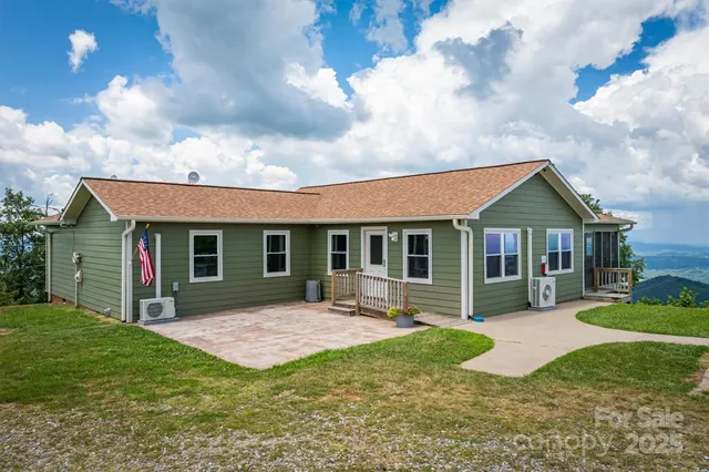 a view of a garden with lawn chairs