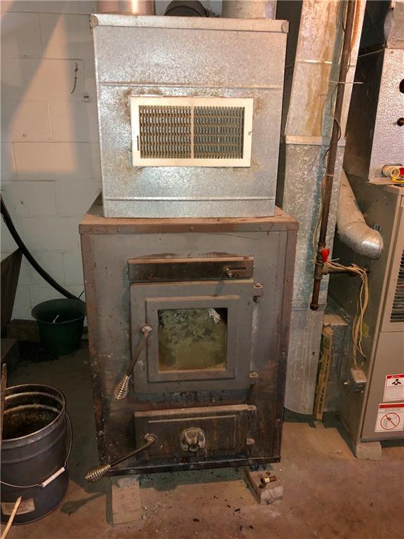 775 Beacom Drive Beaver, PA 15009 - Photo 13 of 15 Wood burner and propane furnace so you can choose to heat the home with propane or wood.