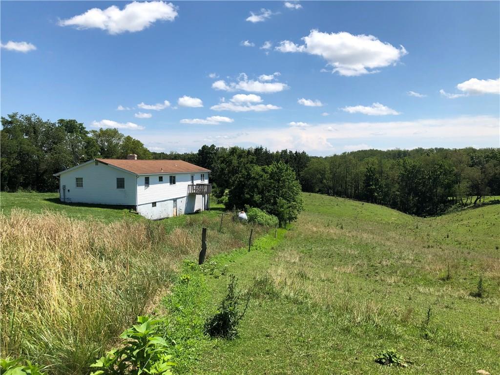 775 Beacom Drive Beaver, PA 15009 - Photo 15 of 15 Rear of home showing walk out from basement and Master Suite deck.
