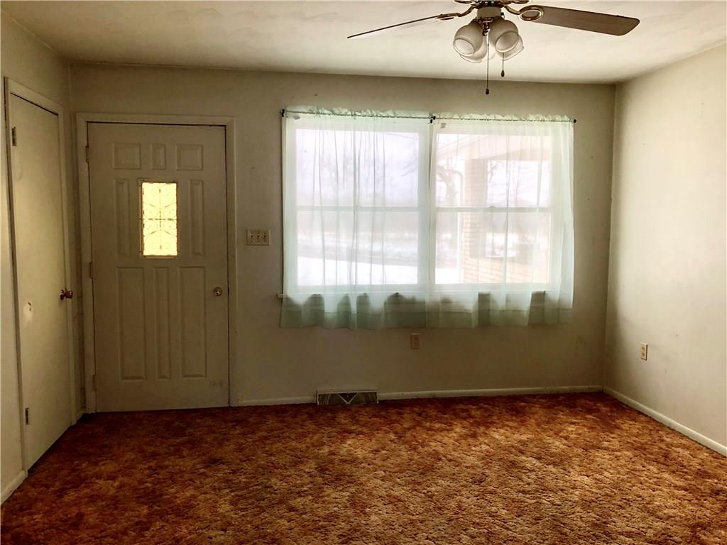 775 Beacom Drive Beaver, PA 15009 - Photo 10 of 15 Original Living Room. The former tenant used this as an additional Bedroom. Door leads outside. Generous closet is located on the left.