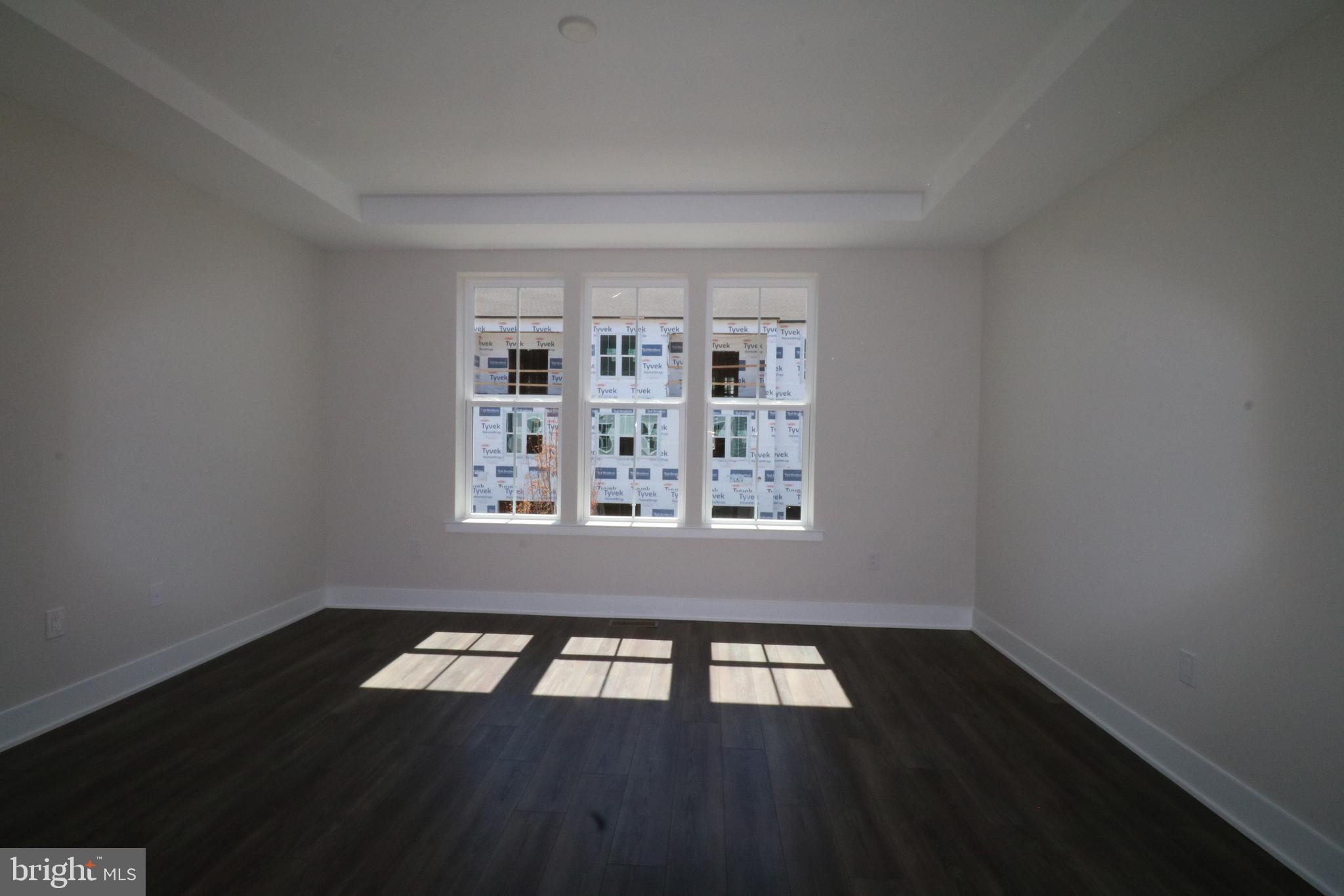 5105 Donatello Drive, Unit 541 Princeton, NJ 08540 - Photo 19 of 36 a view of a livingroom with wooden floor and a window