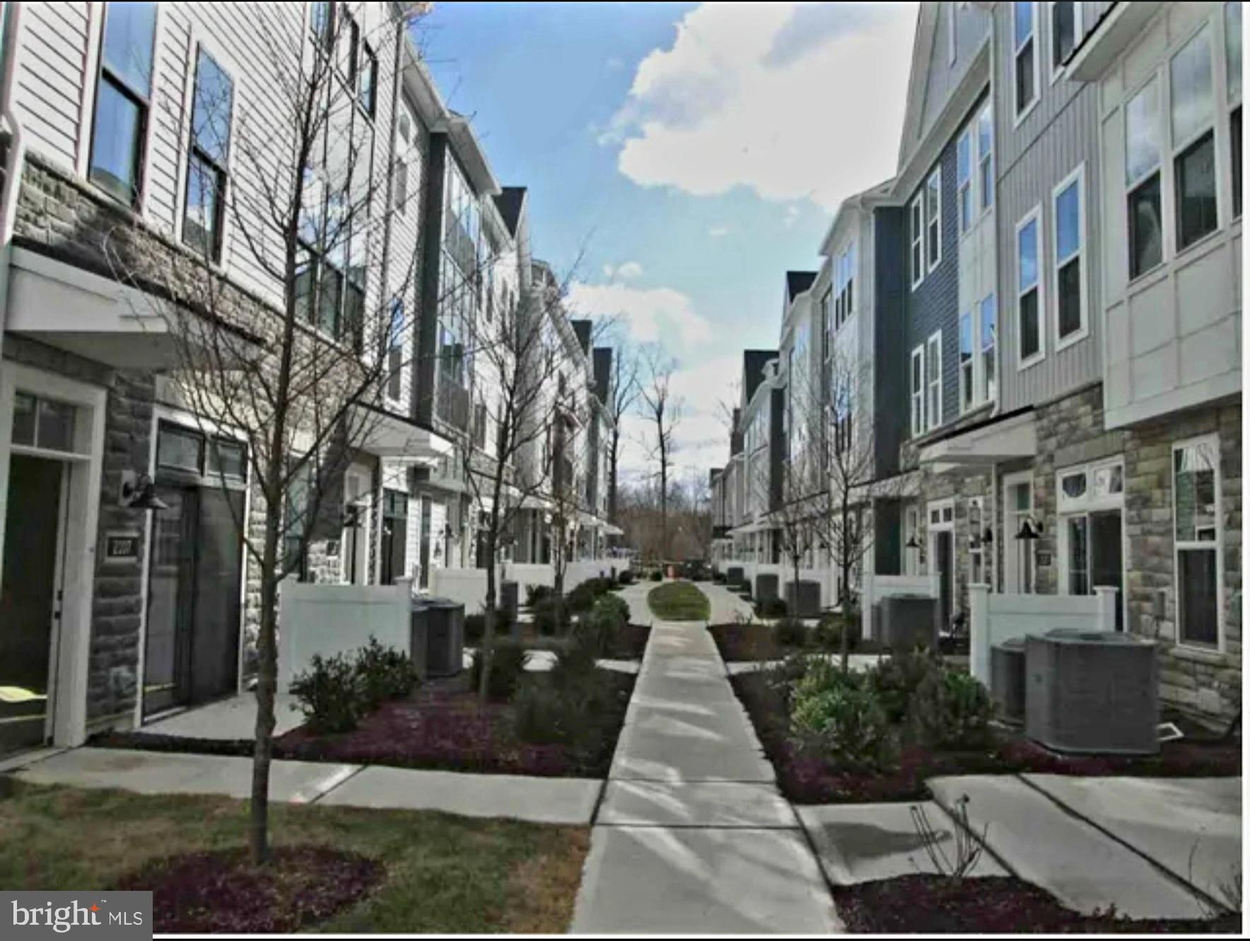 5105 Donatello Drive, Unit 541 Princeton, NJ 08540 - Photo 2 of 36 a view of a pathway both side of building