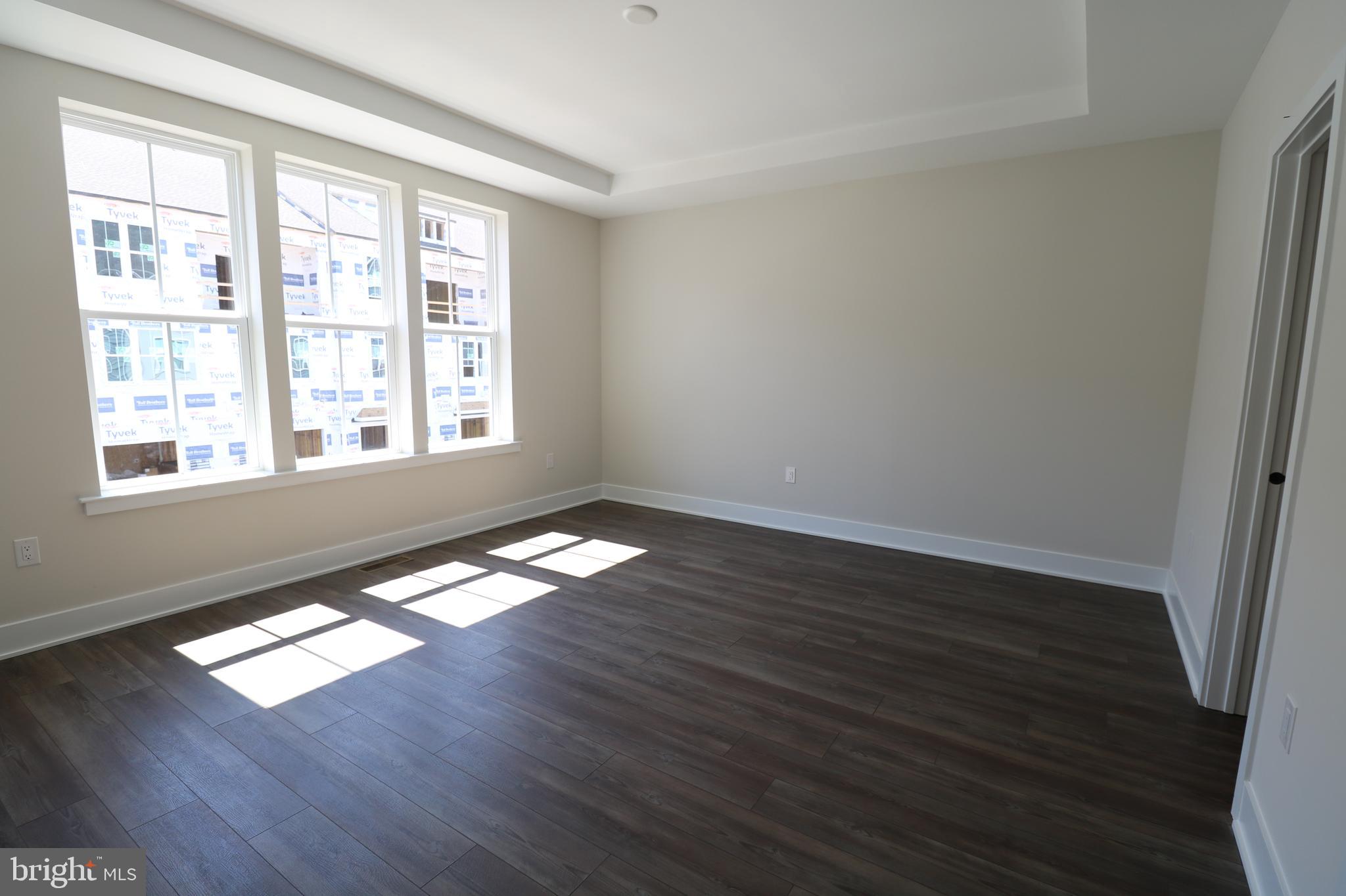 5105 Donatello Drive, Unit 541 Princeton, NJ 08540 - Photo 21 of 36 a view of empty room with wooden floor and fan