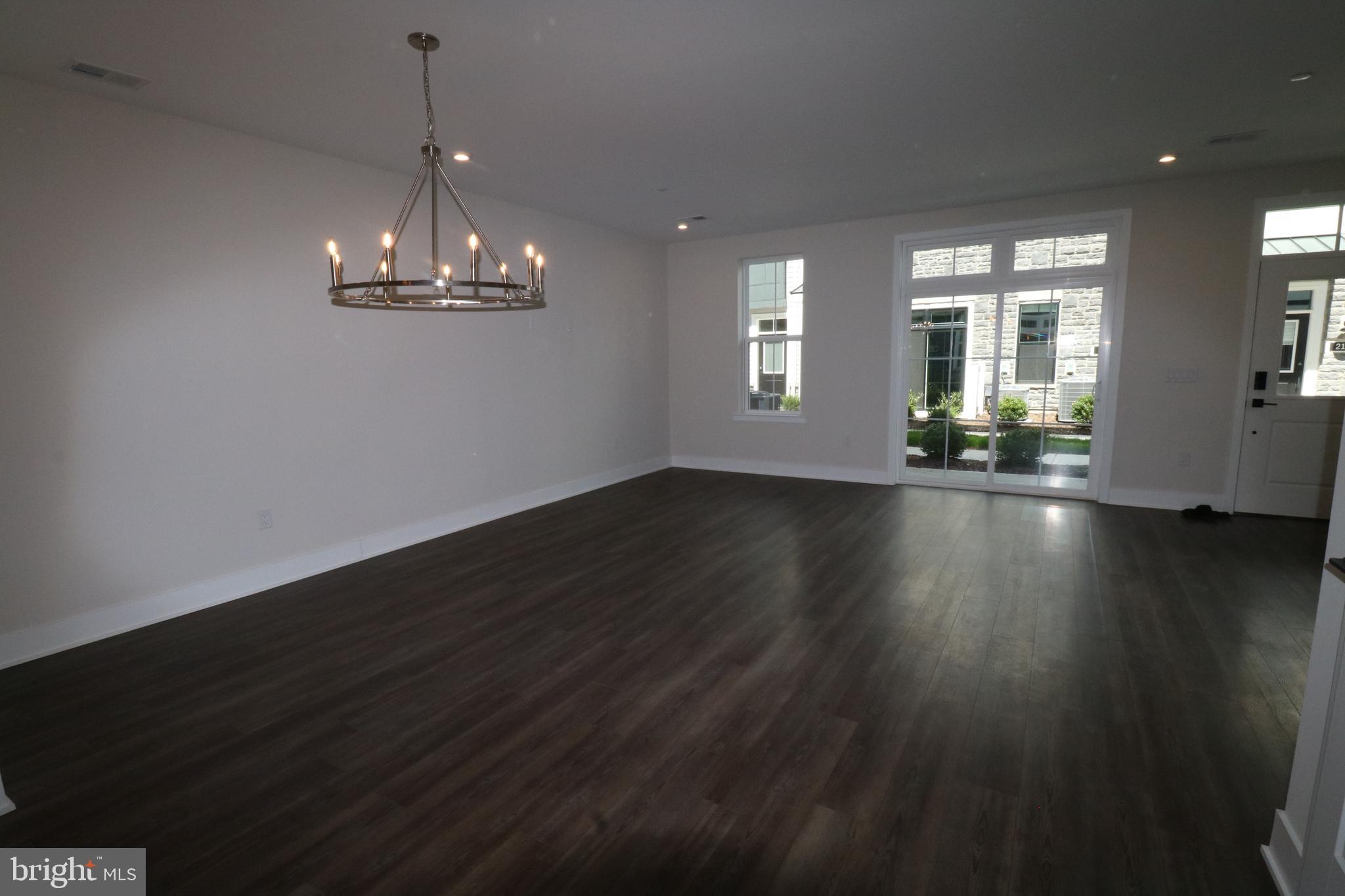 5105 Donatello Drive, Unit 541 Princeton, NJ 08540 - Photo 3 of 36 a view of empty room with wooden floor and window