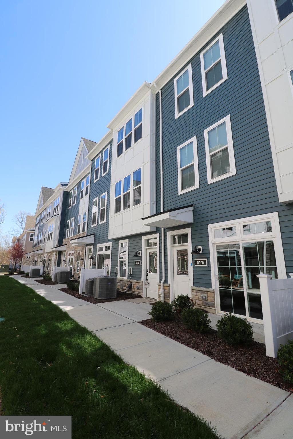 5105 Donatello Drive, Unit 541 Princeton, NJ 08540 - Photo 35 of 36 a front view of a building with a yard