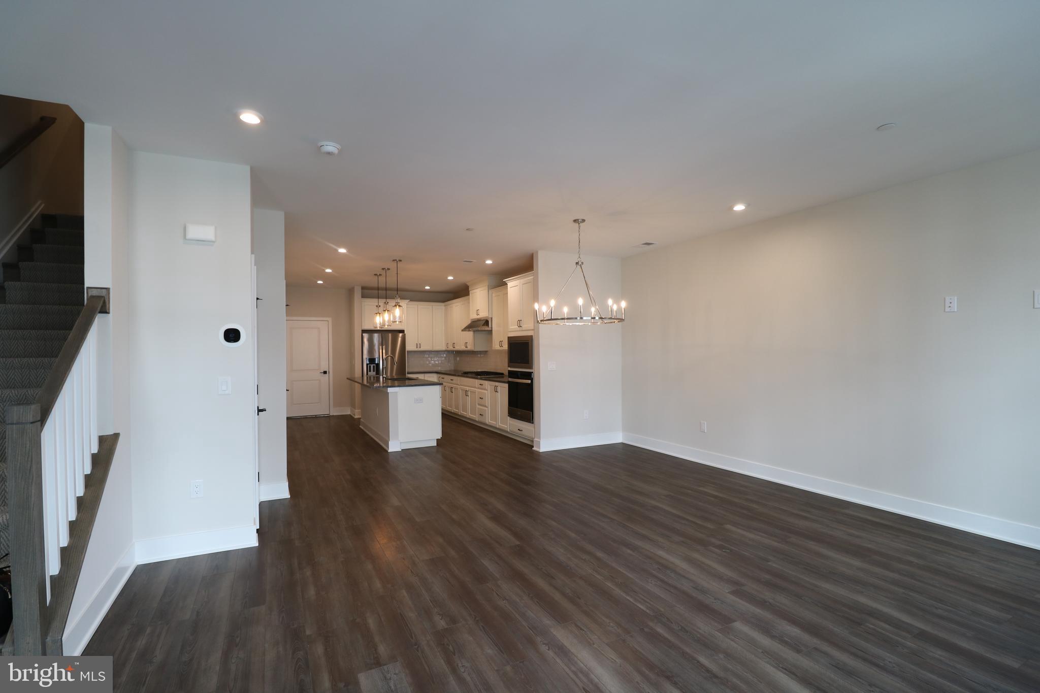 5105 Donatello Drive, Unit 541 Princeton, NJ 08540 - Photo 4 of 36 a view of a kitchen with wooden floor and a sink