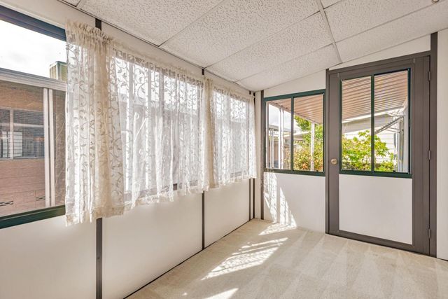 a view of a room with a large window