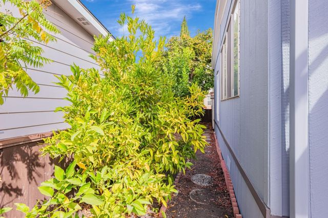 a view of a backyard with sitting area