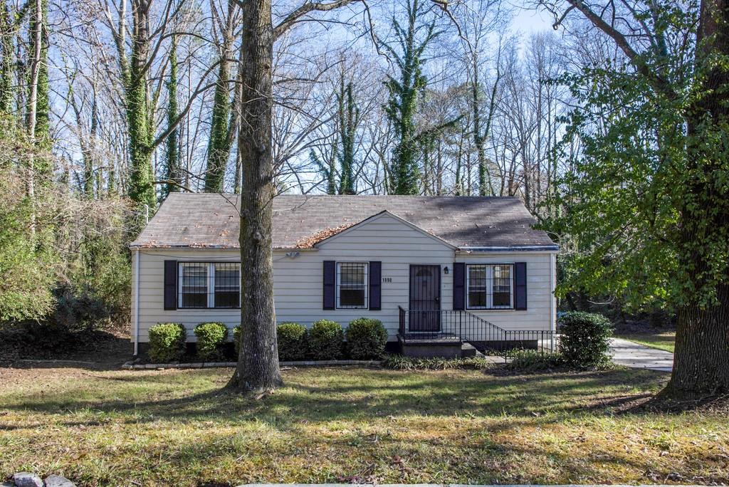 1898 Grant Road Southwest Atlanta, GA 30331 - Photo 1 of 1 a front view of a house with a yard