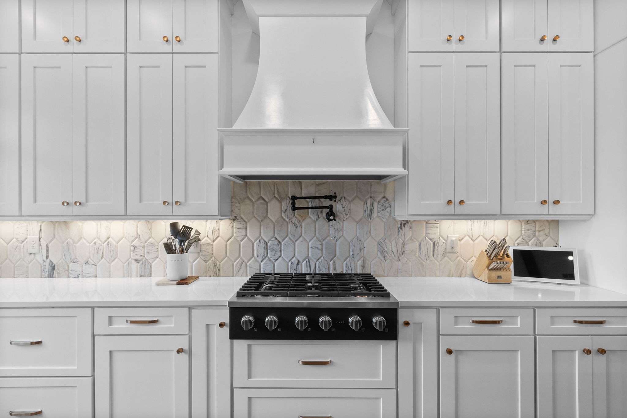 2480 Jarrell Ridge Road Clarksville, TN 37043 - Photo 21 of 69 a kitchen with a stove and white cabinets