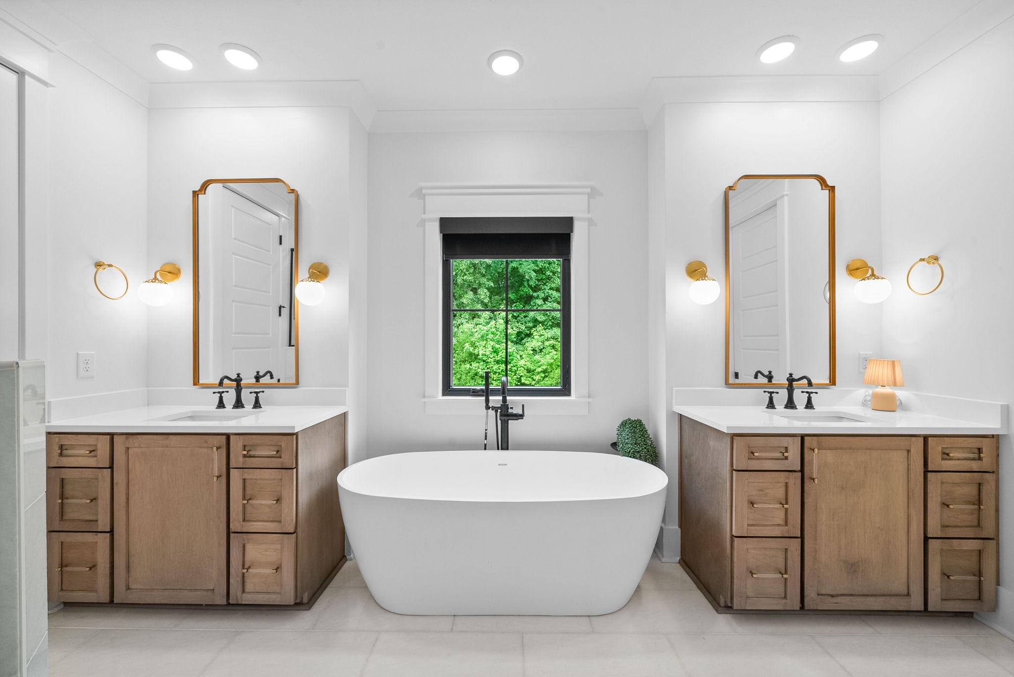2480 Jarrell Ridge Road Clarksville, TN 37043 - Photo 29 of 69 a bathroom with a double vanity sink a mirror and a bathtub