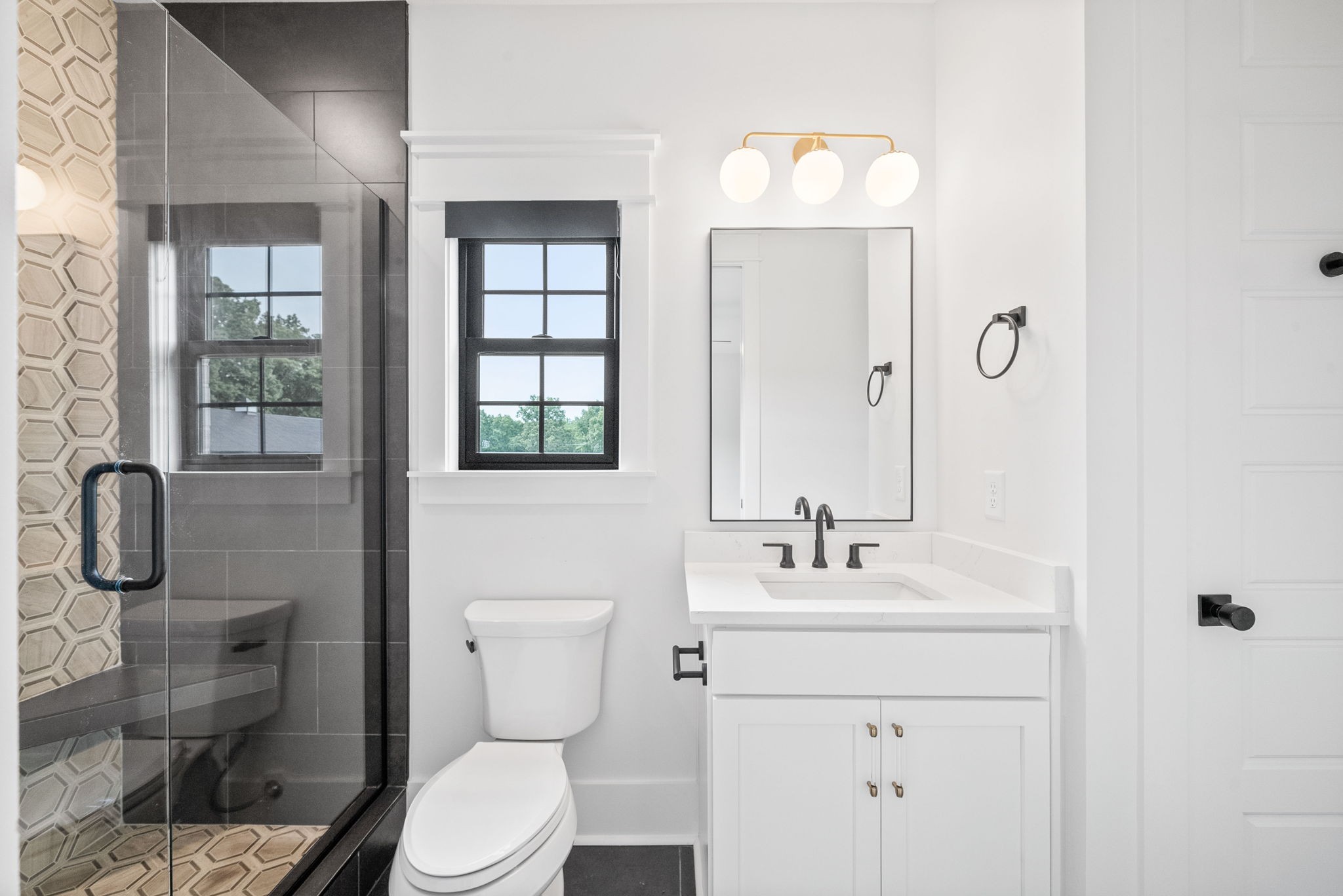 2480 Jarrell Ridge Road Clarksville, TN 37043 - Photo 40 of 69 a bathroom with a toilet sink shower and mirror