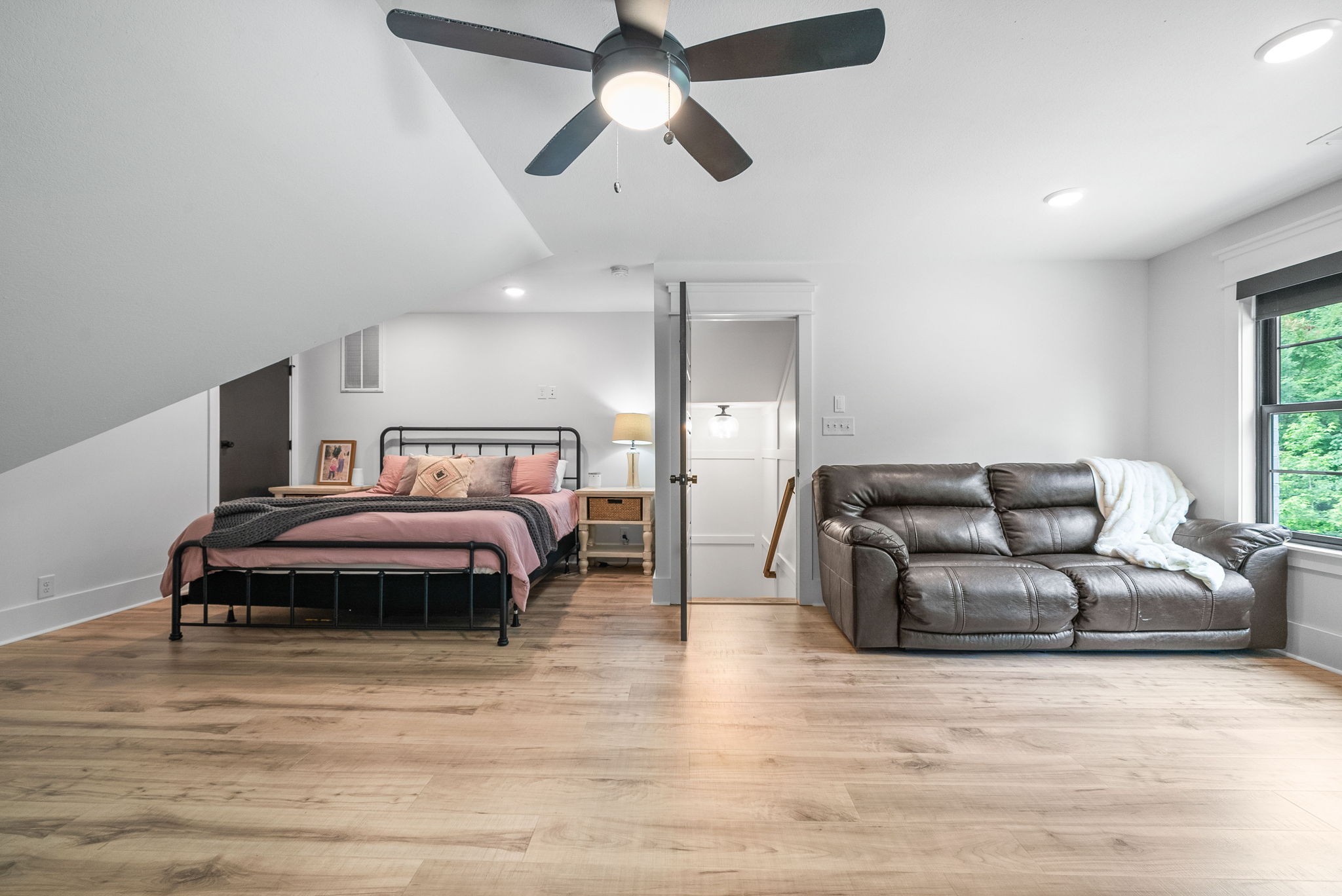 2480 Jarrell Ridge Road Clarksville, TN 37043 - Photo 50 of 69 a living room with a bed furniture and a ceiling fan
