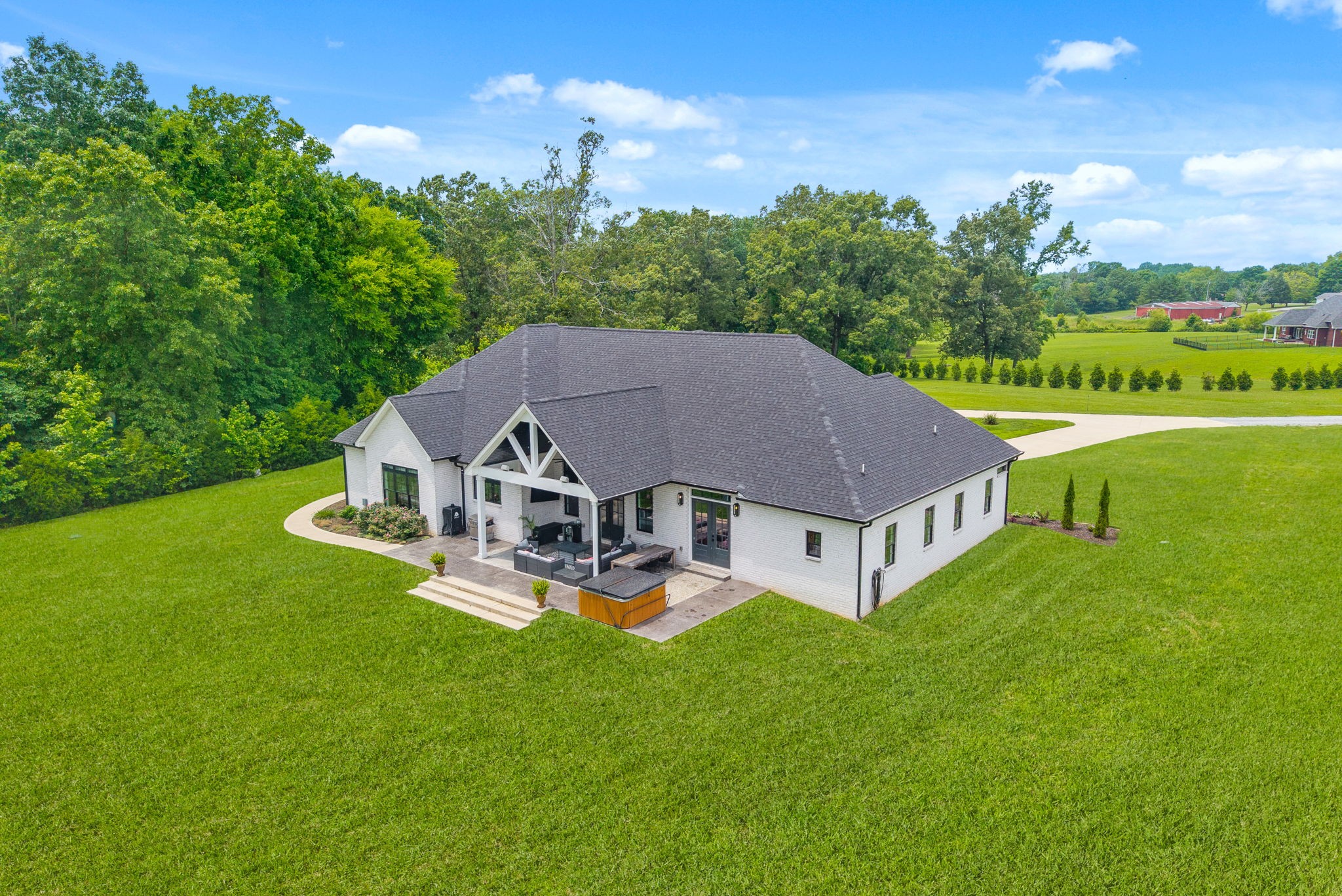 2480 Jarrell Ridge Road Clarksville, TN 37043 - Photo 56 of 69 a aerial view of a house with table and chairs under an umbrella