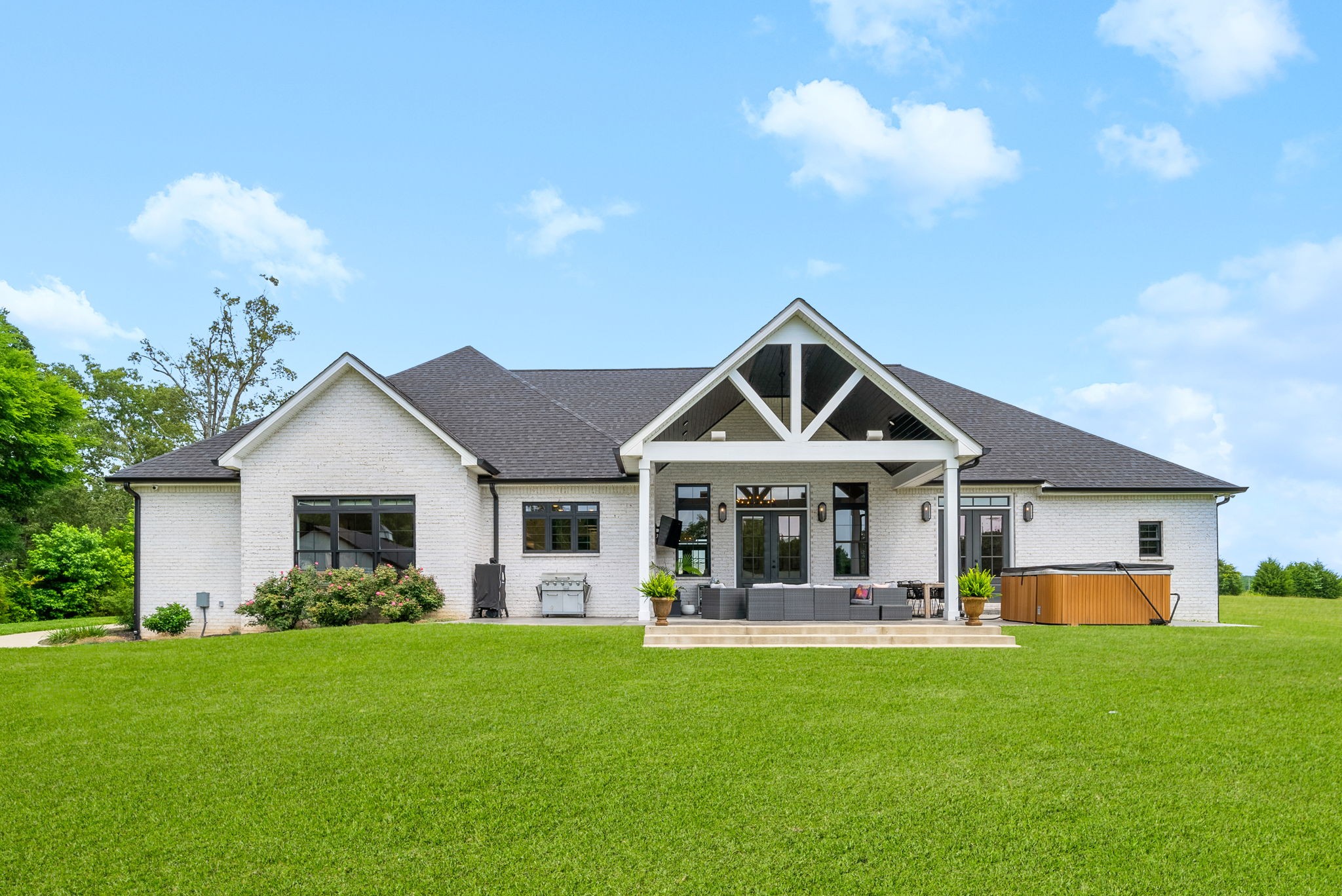 2480 Jarrell Ridge Road Clarksville, TN 37043 - Photo 57 of 69 a front view of a house with a yard and potted plants