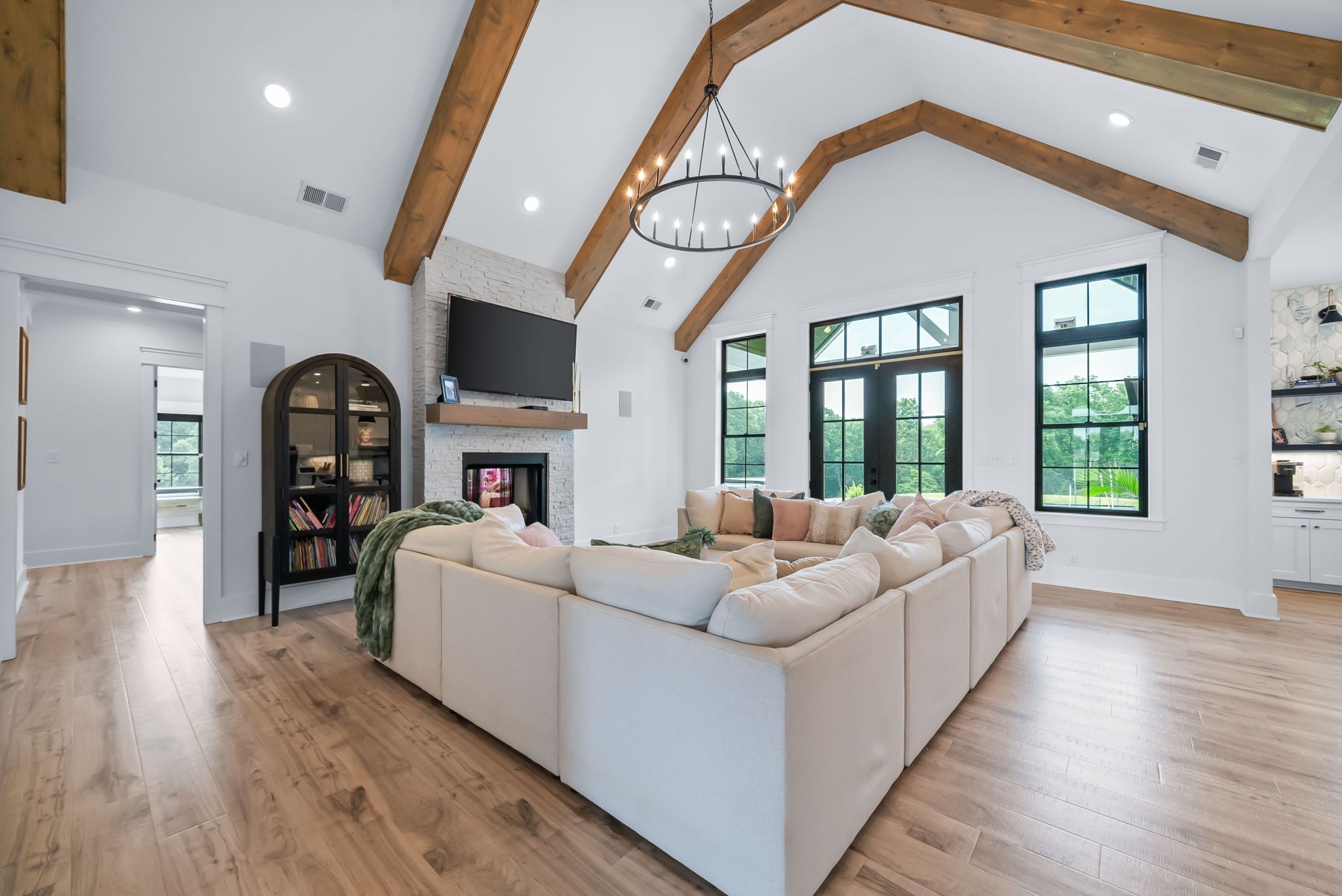 2480 Jarrell Ridge Road Clarksville, TN 37043 - Photo 9 of 69 a living room with furniture a fireplace and a floor to ceiling window