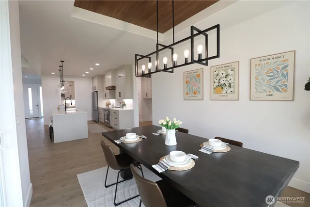 a view of a dining room with furniture and wooden floor