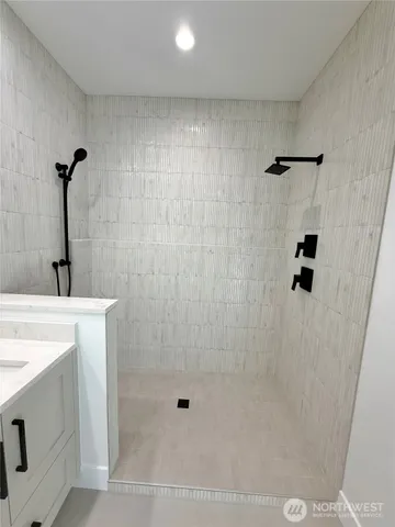 a bathroom with a sink mirror vanity and toilet