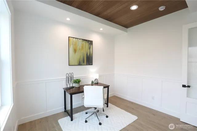 a workspace with furniture and mirror